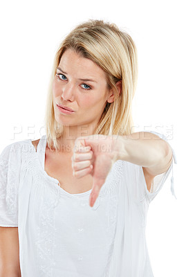 Buy stock photo Portrait, woman and unhappy in studio with thumbs down emoji, negative feedback or disappointment. Person, hand gesture and no symbol for bad review, disagreement or dislike sign on white background.