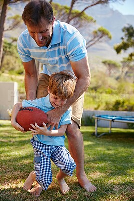 Buy stock photo Dad, playing and child with ball, backyard and bonding with son at home, fun or physical development. Happy, man and game with boy, growth and fitness for gross motor skills, learn and sport at house