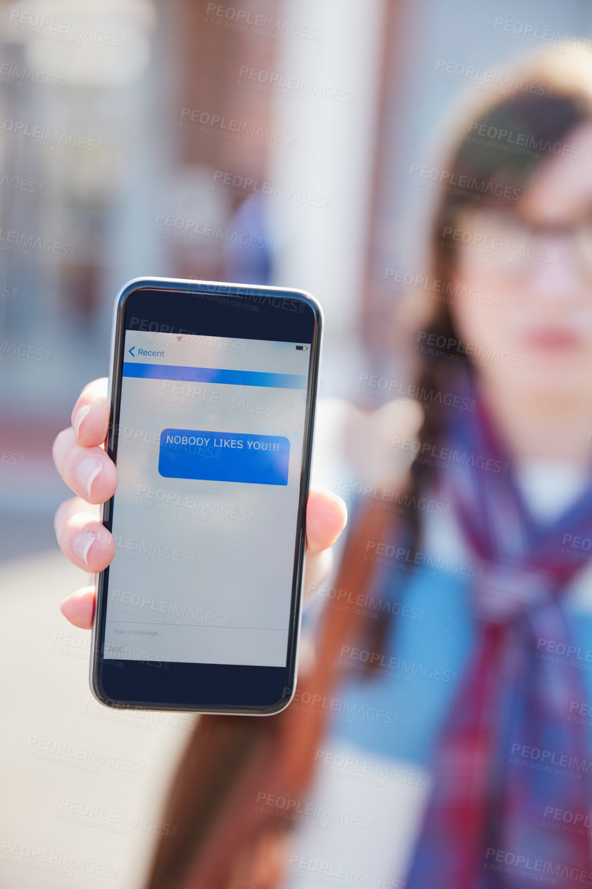 Buy stock photo Hand, phone screen and cyber bullying at university with text message, stalker or notification at campus. Person, smartphone and rude chat with harassment, mobile app and social network at college