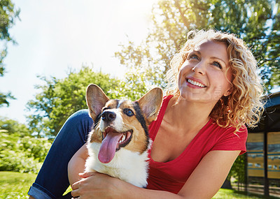 Buy stock photo Woman, smile and hug in park with dog, thinking or companion for bonding together on summer holiday. Bokeh, person outdoor and embrace with Corgi puppy, reflection or loyal friendship for protection.