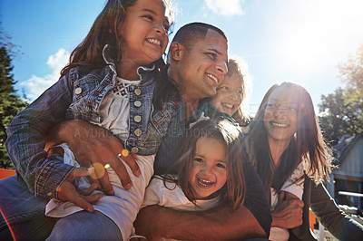 Buy stock photo Parents, children and happy with hug outdoor for family fun, weekend break and healthy relationship. Lens flare, mother and father with kids on holiday with bonding, support and embrace at farmhouse