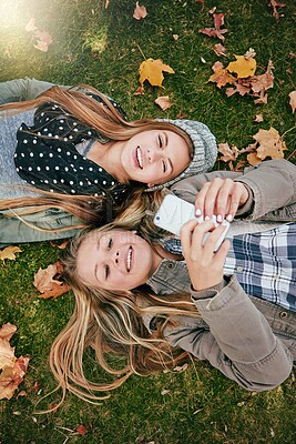 Buy stock photo Phone, typing and happy with friends in park for social media comment, post status update and text message. Communication app, online platform and bonding with above of girl outdoor as teenager