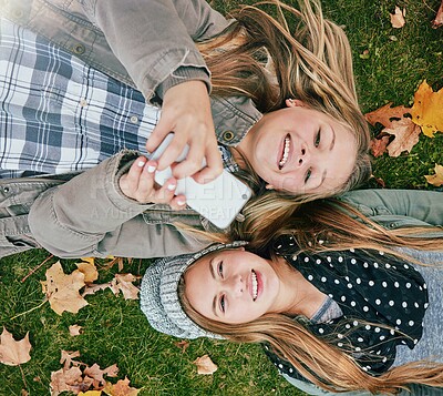 Buy stock photo Phone, reading and happy with friends in park for social media comment, post status update and text message. Communication app, online platform and bonding with above of girl outdoor as teenager