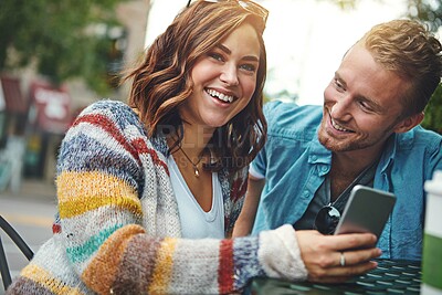Buy stock photo Cellphone, laugh and couple at coffee shop on date with laughing for social media, networking or texting. Happy, technology and man with woman on phone for chatting on mobile app together at cafe.