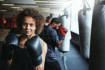Buy stock photo Boxing class, woman and punching bag in gym for fitness training, competition practice or self defense. Mature person, boxer or portrait at health club for fight conditioning, combat sport or workout