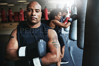 Buy stock photo Portrait, boxer and man with confidence for fitness, sports or determined trainer in gym for combat. Boxing coach, athlete and serious person with pride, exercise and arms folded with flare in club