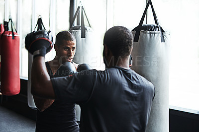 Buy stock photo Man, boxer and fitness with personal trainer at gym for training, punching technique and combat. Person, boxing and coach with mitts for self defense practice, fighting skills and sparring workout