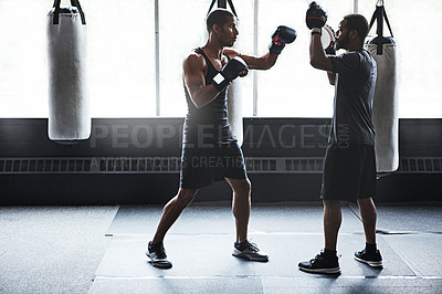 Buy stock photo Athlete, people and boxing with personal trainer at gym for training, punch technique and combat. Boxer, fitness coach and sports mitts for self defense practice, fighting skills and sparring workout