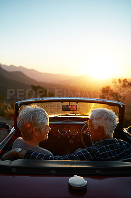 Buy stock photo Sunset, road trip and senior couple with view of nature for travel break, romantic getaway and support. Dusk, mockup space or old people with bonding in convertible car for journey pause or adventure