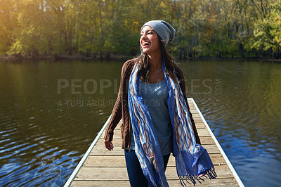 Buy stock photo Thinking, laugh and woman at pier by lake for travel, adventure and vacation in nature. Jetty, reflection and happy person outdoor on holiday, sightseeing and funny thoughts with positive mindset