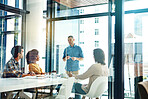 Briefing his team in the boardroom