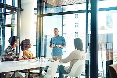 Buy stock photo Design, meeting and presentation with people in workplace boardroom for coaching, training or update. Collaboration, explain and upskill development with designer group in glass office together