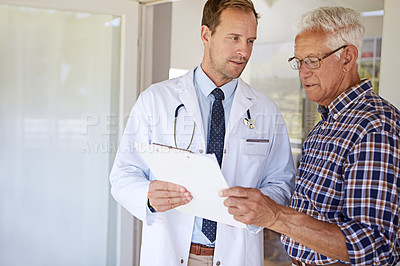 Buy stock photo Clipboard, checkup and doctor with elderly man in clinic for discussion on medical diagnosis. Checklist, consultation and healthcare worker with senior male patient for treatment planning in hospital