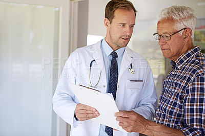 Buy stock photo Clipboard, conversation and doctor with senior man in clinic for discussion on medical diagnosis. Checklist, checkup and healthcare worker with elderly male patient for treatment planning in hospital