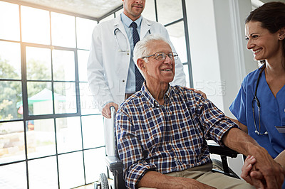 Buy stock photo Doctor, nurse and senior man in wheelchair for healing, healthcare or medical consulting. Conversation, recovery and smile of old person with disability in hospital for advice or rehabilitation