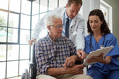Buy stock photo Doctor, nurse and old man in wheelchair with clipboard for healing or medical consulting. Conversation, paperwork and recovery of senior person with disability in hospital for rehabilitation advice