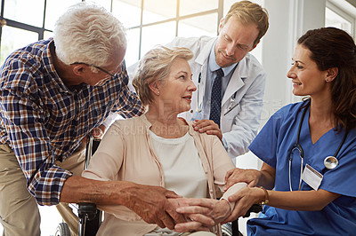 Buy stock photo Consultation, doctor and nurse with senior woman in nursing clinic for healthcare discussion. Couple, checkup and elderly female patient in wheelchair with medical employees in retirement facility.