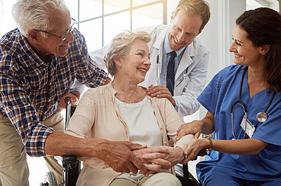 Buy stock photo Doctor, nurse and senior woman in wheelchair at nursing clinic for healthcare discussion. Couple, checkup and elderly female patient with disability with medical employees in retirement facility.