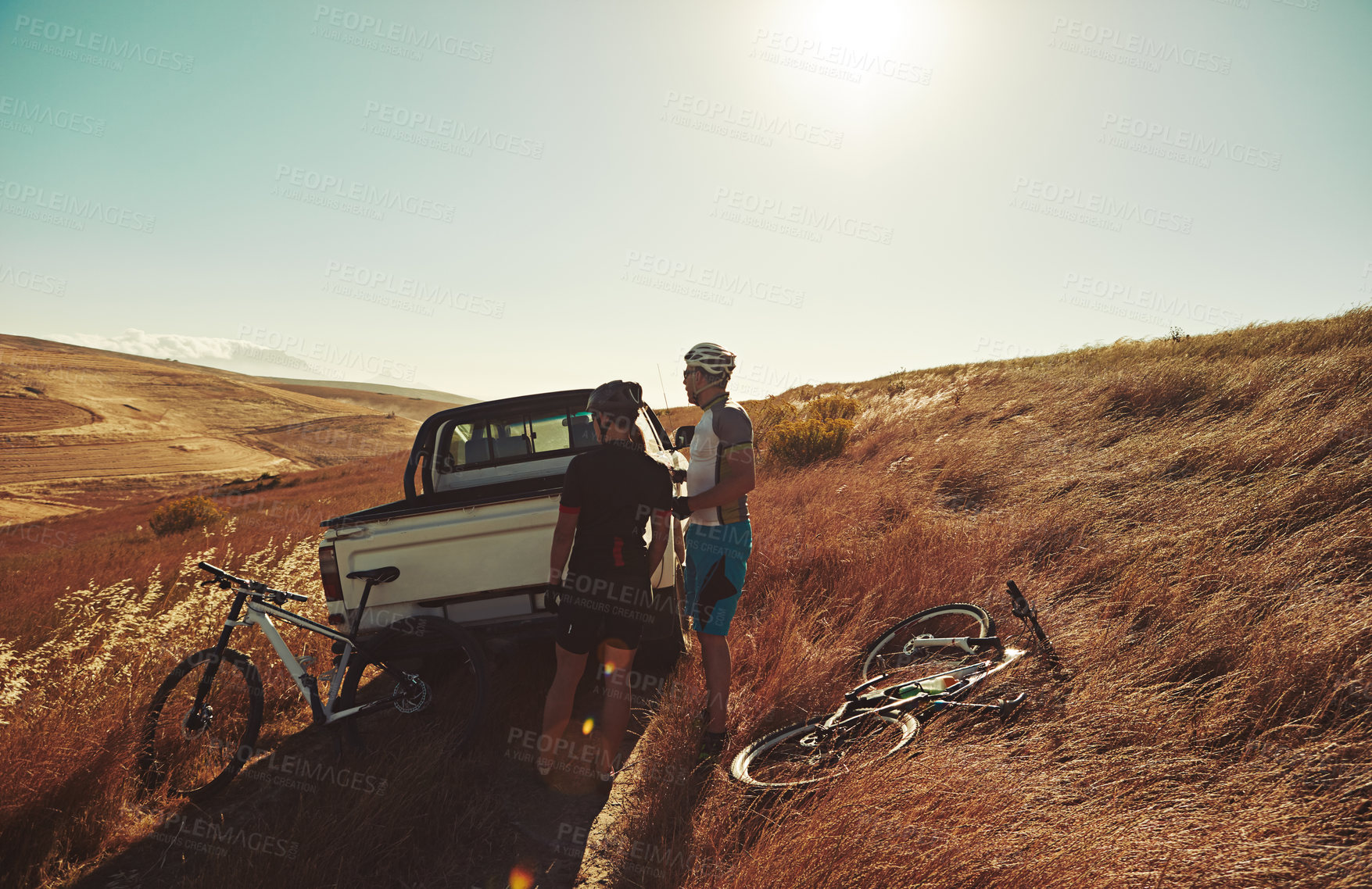 Buy stock photo Sports, morning and people with bicycle in truck for cycling, exercise and training in countryside. Fitness, sunrise and men with bikes in vehicle for adventure, travel and active hobby on trail