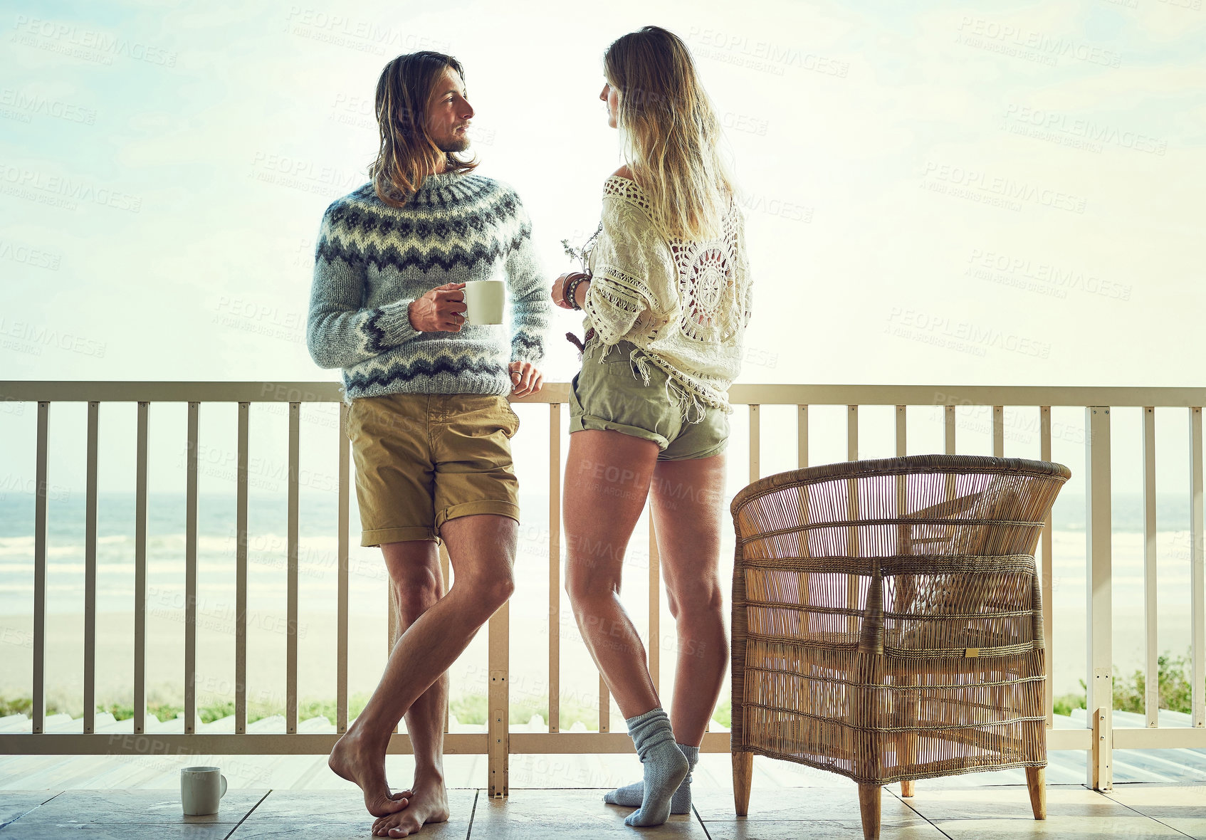 Buy stock photo Love, vacation or couple on balcony with coffee, healthy relationship or bonding on seaside trip. Connection, man or woman on patio with warm drink, commitment or morning together on romantic holiday