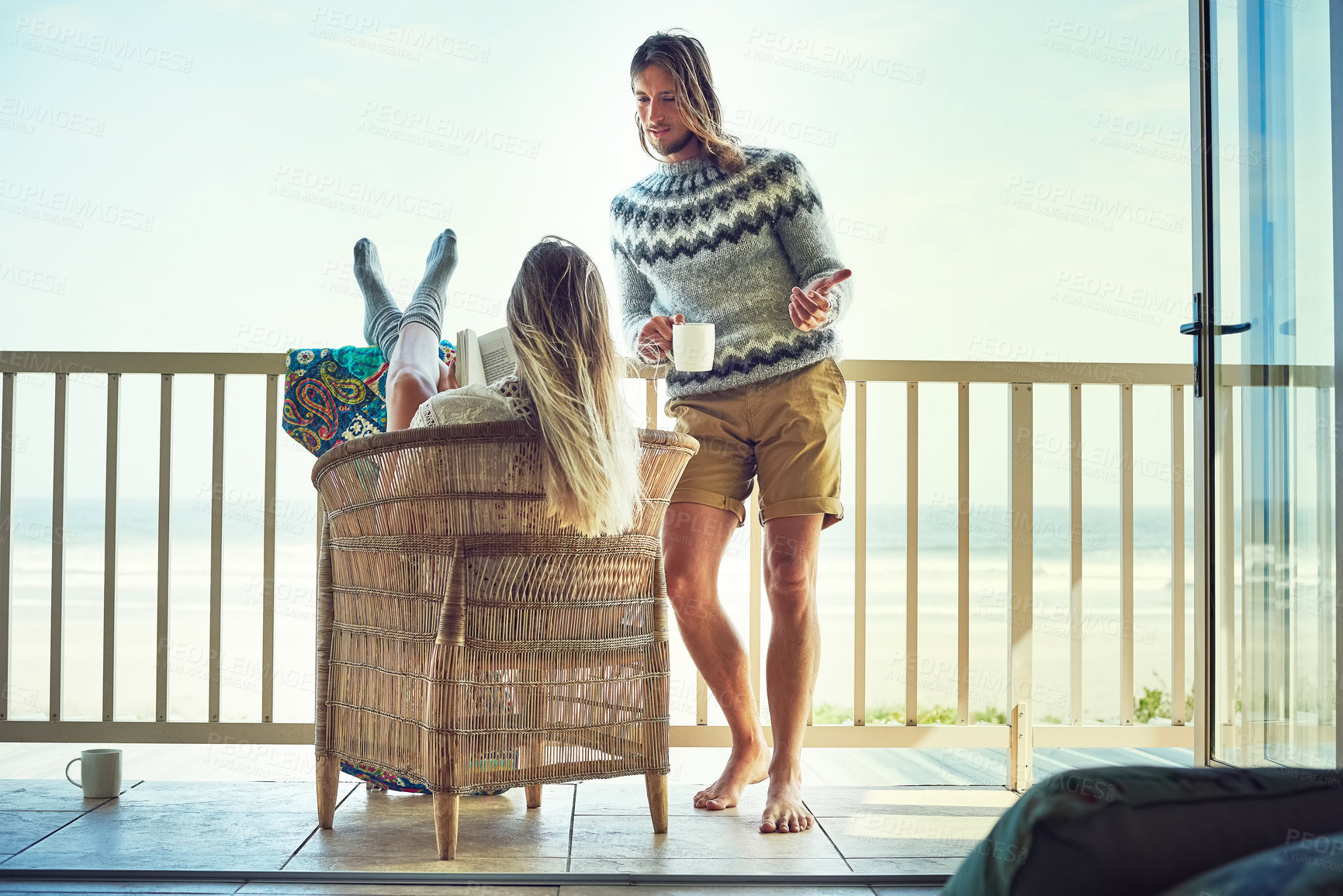 Buy stock photo Coffee cup, man or woman on balcony with reading, bonding together or communication in healthy relationship. Love, space or couple on patio with hobbies, connection or romantic moment in start of day