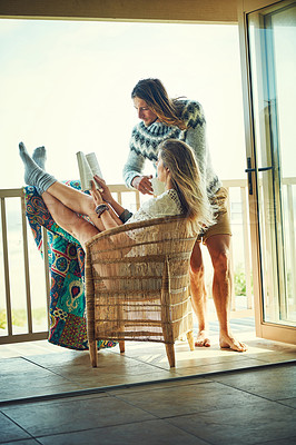 Buy stock photo Boho, reading and couple on balcony of lodge together for holiday, vacation or weekend getaway. Bonding, relax or travel with man and woman drinking coffee outdoor at guest house for storytelling