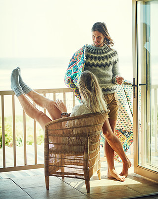 Buy stock photo Balcony, boho and relax with couple at lodge together for holiday, vacation or weekend getaway. Break, love or travel with man and woman outdoor at beach house for bonding, conversation or trip