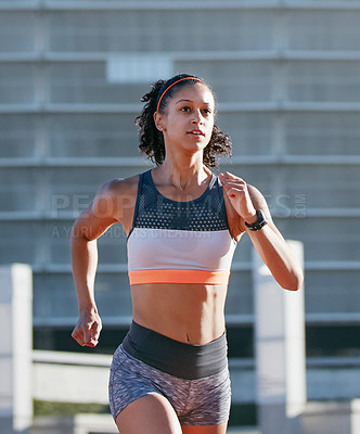 Buy stock photo Runner, training and woman in city, sport and exercise routine for health goals, serious and active. Outdoor, athlete and African person on weekend, cardio and wellness with workout for fitness
