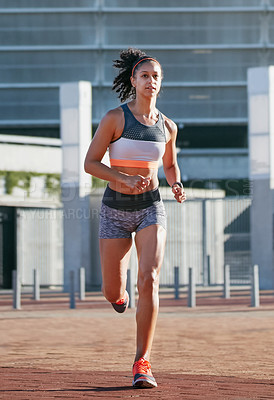 Buy stock photo Running, athlete and woman in city, sport and workout routine for health goals, training and active. Serious, runner and African person on weekend, cardio and wellness with exercise for fitness