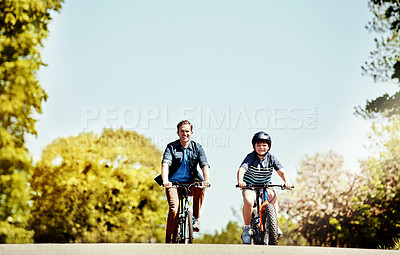 Buy stock photo Dad, boy and happy on bicycle in road for ride, bonding and love with space in neighborhood. People, father and child with cycling, bike or smile with helmet, portrait and connection in Portugal