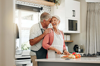 Buy stock photo Senior couple in kitchen, cooking healthy food together and happy in retirement lifestyle. Elderly woman chopping vegetables with apron, old white man hug wife in home and love nutrition dinner meal