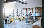 Library, education and students study in university campus, college or school. Learning, diversity and people relax with books, laptop or phones together for knowledge, research or exam preparation

