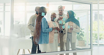 Buy stock photo Planning, collaboration and sticky notes on glass in the office with a business team talking about strategy. Teamwork, meeting and coaching with a black woman leader teaching her staff at work