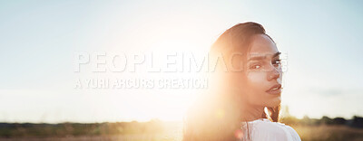 Buy stock photo Portrait, woman and confident in field for travel adventure, summer holiday and fresh air. Space, banner and female person with lens flare in meadow, explore nature or vacation getaway in countryside