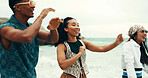 Happy, people and dancing on beach outdoor with energy, movement and vacation reunion for rave festival. Group, friends and rhythm at island party, summer freedom and bonding together of travel trip 