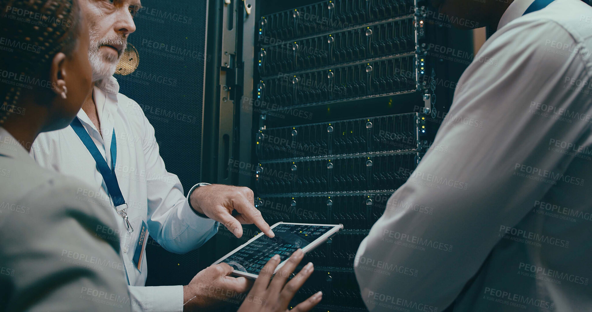 Buy stock photo Tablet screen, server room and people in discussion for code or system performance. Group, technology and technician in data center for network diagnostics, software analytics and IT maintenance