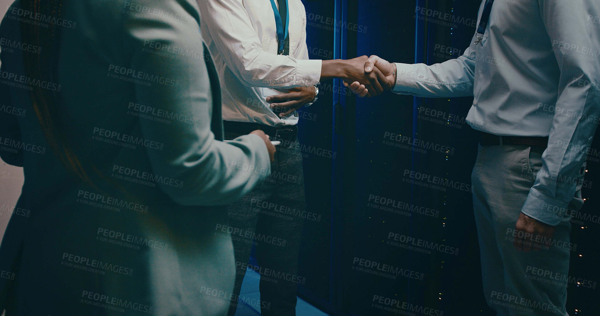 Buy stock photo Agreement, handshake and welcome with people in server room for network administration deal. Cybersecurity, meeting and thank you with team shaking hands in data center for tech support collaboration
