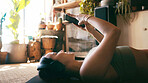 Yoga, headphones and reading with woman on floor for guided meditation, streaming and wellness podcast. Connection, zen and calm sound with person in home for fitness, subscription and phone