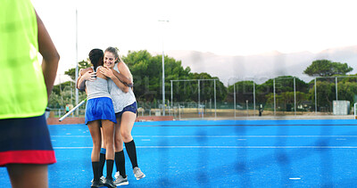Buy stock photo Hockey, team and women with hug outdoor for practice win, match performance and training success. Sport, fitness and happy players with embrace on pitch for game achievement, exercise and well done
