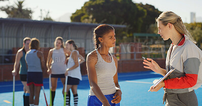 Buy stock photo Sports, hockey and women outdoor with coach talking for training, practice and exercise. Team, happy and back of people in conversation for playing match, game or tournament on turf for fitness hobby