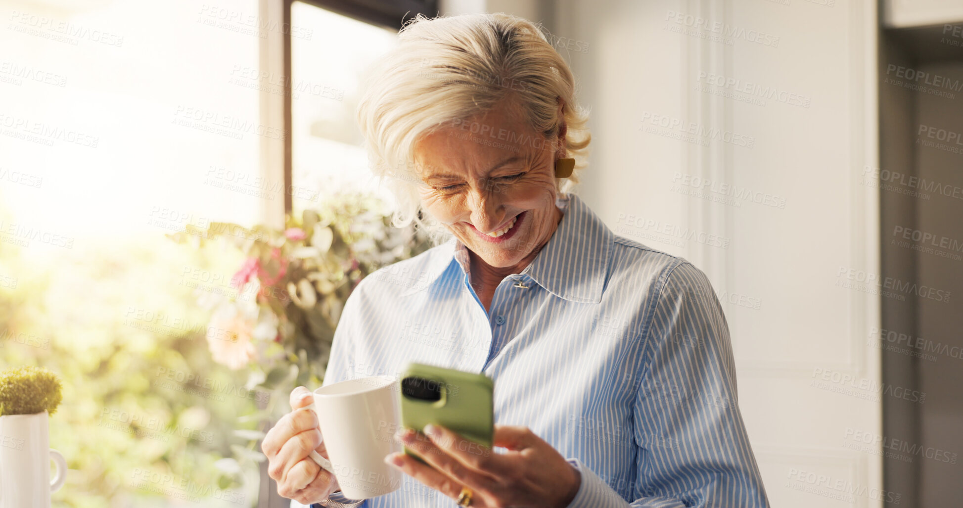 Buy stock photo Home, cellphone and old woman with smile, coffee and comedy video with social media. Online humor, pensioner and mature person with smartphone, internet and network with funny meme and communication