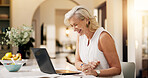 Mature woman, laptop and happy with remote work from home, feedback and budget review in kitchen. Mature person, financial advisor or broker with pc, smile or asset management with investing at house