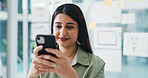 Cellphone, happy and woman in office with networking, communication or texting on app for break. Smile, technology and female person with phone with chatting, email or social media in workplace.