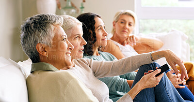 Buy stock photo Mature people, watching tv and choice on sofa for movie, show or series in home. Women, group or friends with smile, remote or streaming moment for living room entertainment together in house