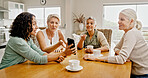 Mature women, friends and phone at house for social media, browsing website and reading gossip. Group, people and mobile for celebrity news, review post and message notification at reunion gathering