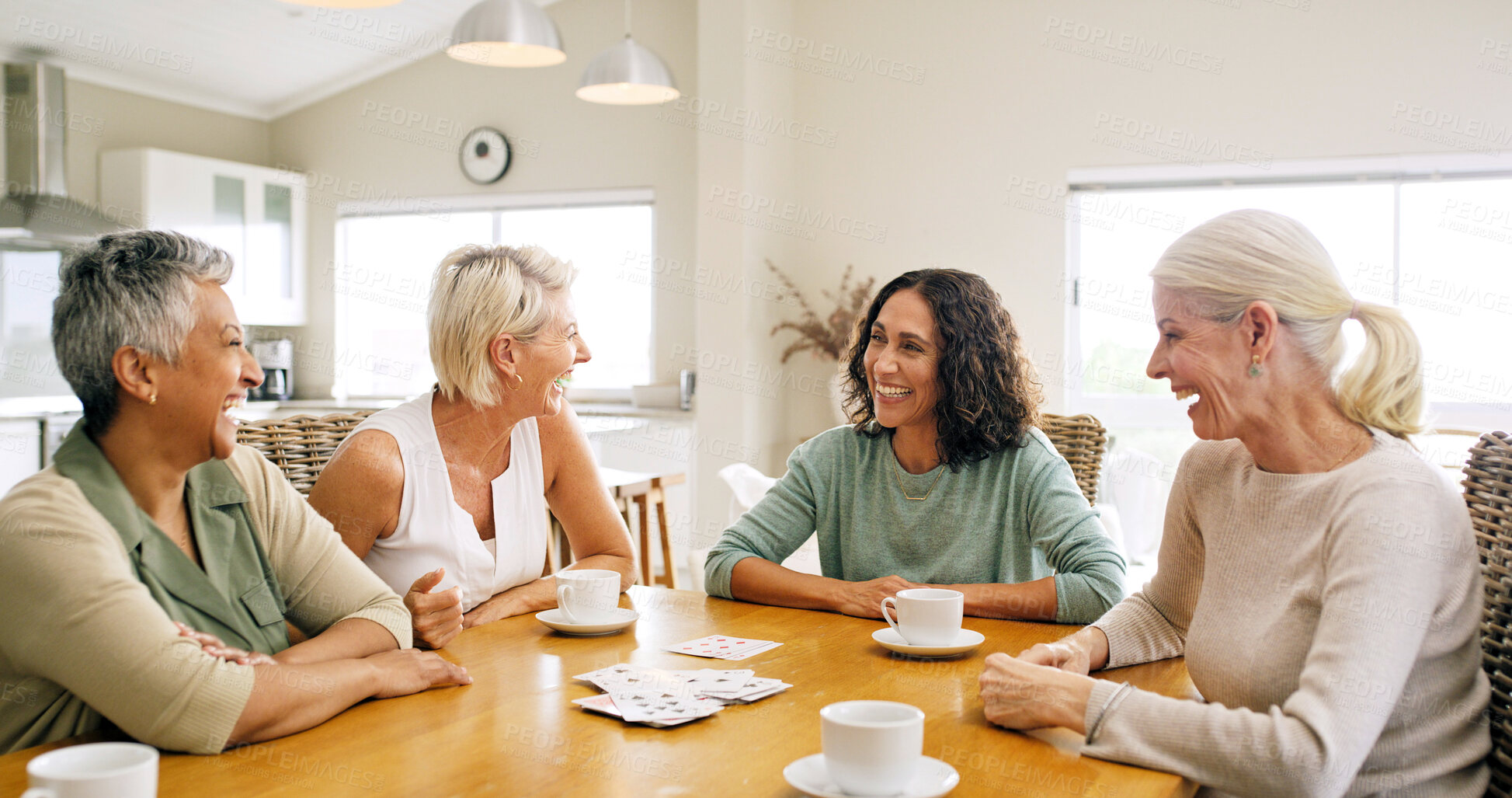 Buy stock photo Cards, friends and senior woman at table for chat, weekend reunion and funny conservation for entertainment. Tea party, laugh and elderly people with smile in home, gossip and bonding for connection