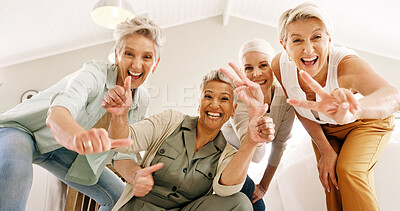 Buy stock photo Energy, hand gesture and portrait of old women in home together for bonding or fun from below. Excited, peace sign and thumbs up emoji with group of happy senior friends in apartment for retirement