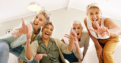 Buy stock photo Portrait, senior women and smile with peace sign, thumbs up or bonding together for fun memory in home. Low angle, elderly people or excited with like symbol, v gesture or emoji for happy friendship.