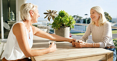 Buy stock photo Coffee, conversation and support with woman friends on home balcony together for bonding or wellness. App, drink and reunion with happy mature people outdoor at apartment for beverage, break or relax