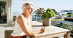 Balcony, coffee and thinking with senior woman at apartment for break, reflection or retirement. Home, ideas or relax and old female person with drink outdoor for fresh air, me time or planning